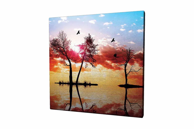 Canvastavla 45x45 cm - Silhuetter av träd vid en solnedgång med reflektioner i vattnet, Orange / Rosa / Blå