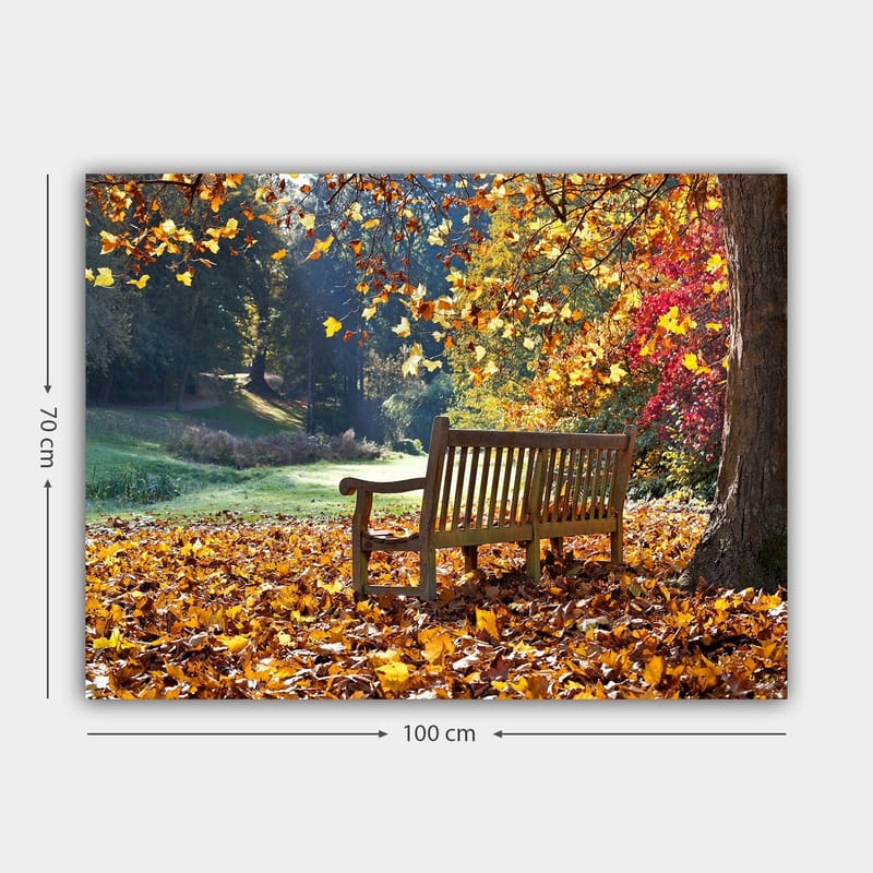 Canvastavla 70x100 cm - Bänk omgiven av färgglada höstlöv i en naturskön miljö - Orange / Gul / Röd - Inredning - Tavlor & posters - Canvastavla