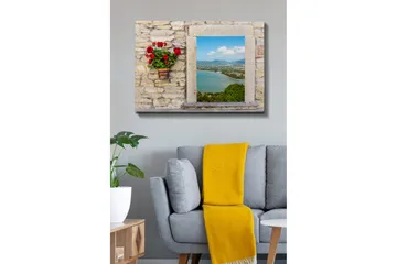 Canvastavla 70x100 cm - Blomkruka med röda blommor på en stenig vägg som ramar in en vacker utsikt över havet och landskapet - Röd / Grön / Beige - Inredning - Tavlor & posters - Canvastavla