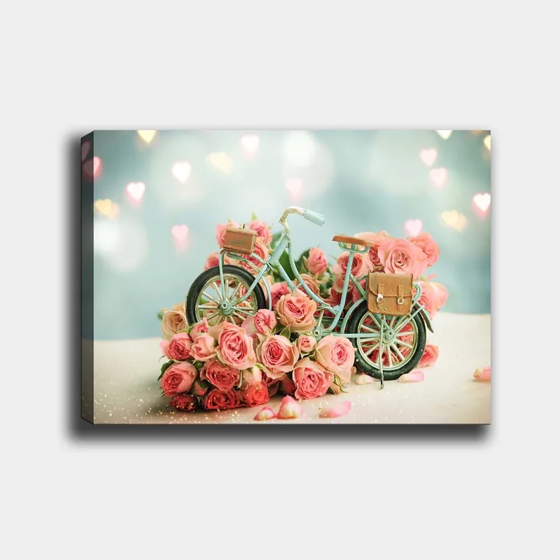 Canvastavla 70x100 cm - Cykel omgiven av rosa rosor i en romantisk och drömlik miljö, Rosa / Mintgrön / Svart