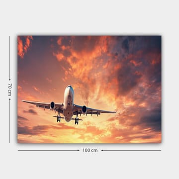 Canvastavla 70x100 cm - Ett flygplan som landar mot en dramatisk solnedgång med färgglada moln - Orange / Lila / Blå - Inredning - Tavlor & posters - Canvastavla