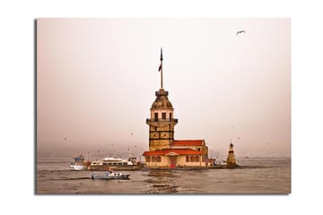 Canvastavla 70x100 cm - Ett historiskt fyrtorn som reser sig över vattnet i en dimmig atmosfär - Beige / Orange / Brun - Inredning - Tavlor & posters - Canvastavla