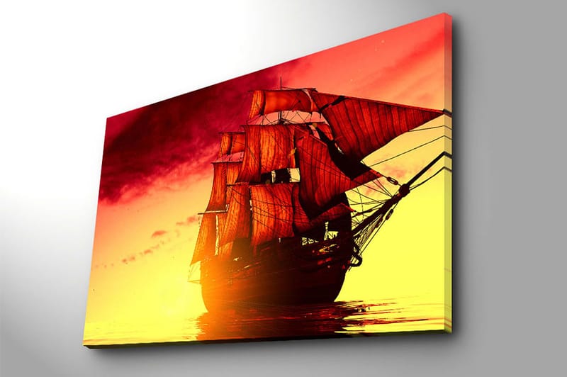Canvastavla 70x100 cm - Ett majestätiskt segelfartyg med röda segel som navigerar genom en gyllene solnedgång - Röd / Orange / Gul - Inredning - Tavlor & posters - Canvastavla