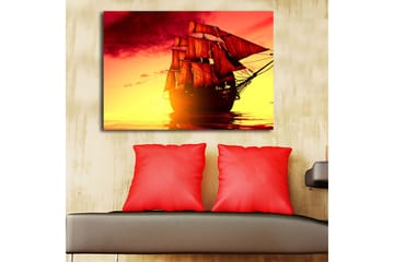 Canvastavla 70x100 cm - Ett majestätiskt segelfartyg med röda segel som navigerar genom en gyllene solnedgång - Röd / Orange / Gul - Inredning - Tavlor & posters - Canvastavla