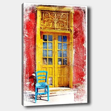 Canvastavla 70x100 cm - Färgglad dörr med en blå stol framför på en röd vägg - Gul / Röd / Blå - Inredning - Tavlor & posters - Canvastavla