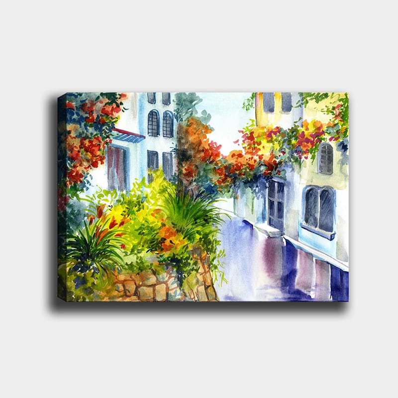 Canvastavla 70x100 cm - Färgglad gata med blommor och grönska i en medelhavsmiljö, Grön / Röd / Blå