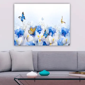Canvastavla 70x100 cm - Färgglad komposition av fjärilar som svävar över vita och blå blommor - Blå / Vit / Gul - Inredning - Tavlor & posters - Canvastavla