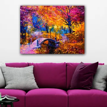 Canvastavla 70x100 cm - Färgsprakande höstscen med en bro som sträcker sig över en stilla vattenyta, omgiven av träd i varma höstfärger - Orange / Lila / Gult - Inredning - Tavlor & posters - Canvastavla