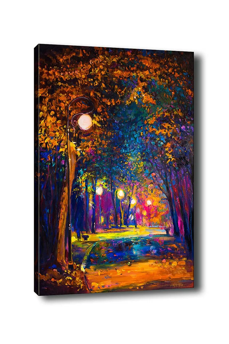 Canvastavla 70x100 cm - Färgstark park med gatulampor som lyser upp en promenadväg omgiven av träd i höstfärger, Mörkblå / Orange / Lila