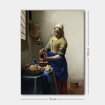 Canvastavla 70x100 cm - Kvinna som häller mjölk i en skål i ett ljust kök - Blå / Gul / Brun - Inredning - Tavlor & posters - Canvastavla