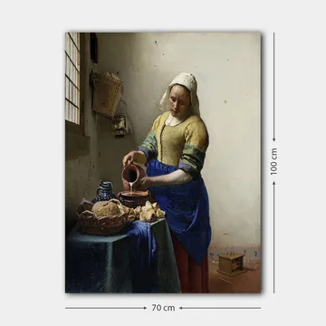 Canvastavla 70x100 cm - Kvinna som häller mjölk i en skål i ett ljust kök - Blå / Gul / Brun - Inredning - Tavlor & posters - Canvastavla
