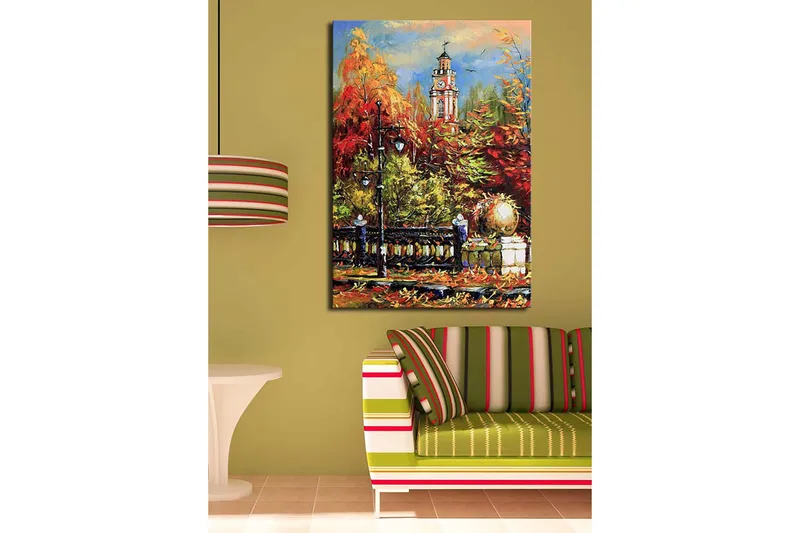 Canvastavla 70x100 cm - Livlig höstscen med en klocktorn i bakgrunden omgiven av färgglada träd och lampor - Röd / Orange / Grön - Inredning - Tavlor & posters - Canvastavla