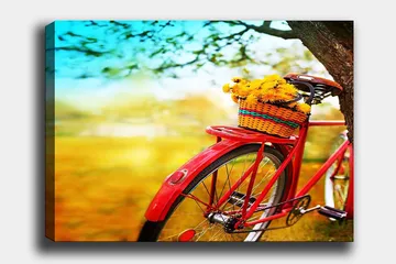 Canvastavla 70x100 cm - Röd cykel med en korg fylld av gula blommor - Röd / Gul / Grön - Inredning - Tavlor & posters - Canvastavla