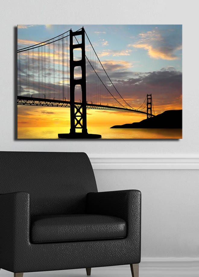 Canvastavla 70x100 cm - Silhuett av en bro mot en färgsprakande solnedgång - Orange / Svart / Blå - Inredning - Tavlor & posters - Canvastavla