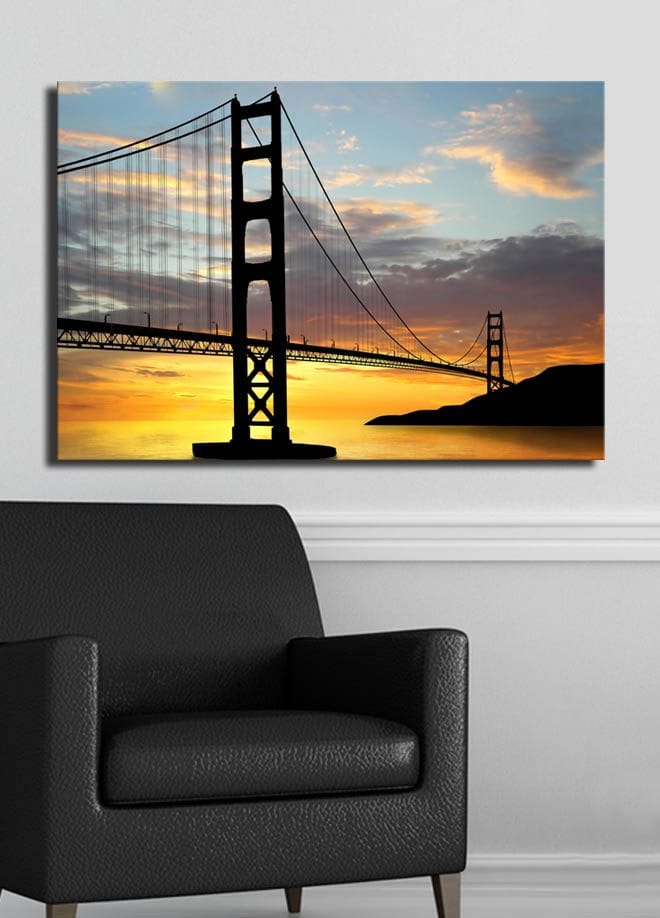 Canvastavla 70x100 cm - Silhuett av en bro mot en färgsprakande solnedgång - Orange / Svart / Blå - Inredning - Tavlor & posters - Canvastavla