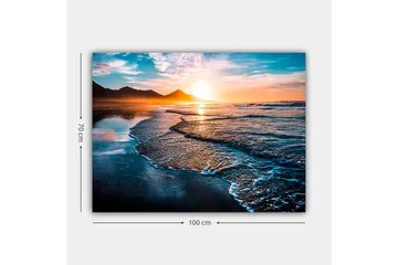 Canvastavla 70x100 cm - Solnedgång över en strand med mjuka vågor som rullar in mot kusten - Blå / Orange / Turkos - Inredning - Tavlor & posters - Canvastavla