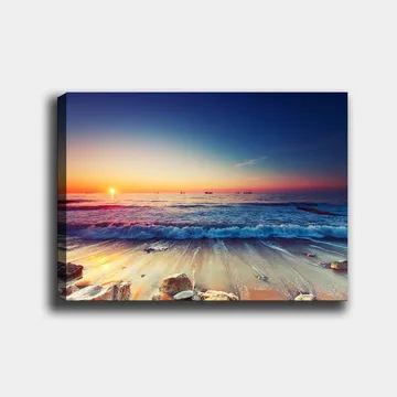 Canvastavla 70x100 cm - Solnedgång över havet med mjuka vågor som rullar in mot stranden - Blå / Orange / Rosa - Inredning - Tavlor & posters - Canvastavla