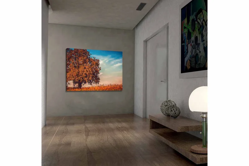 Canvastavla 70x100 cm - Stor, orange trädkrona i höstfärger mot en klarblå himmel, Orange / Blå / Beige