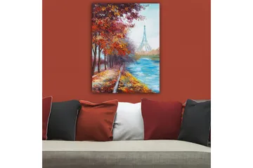 Canvastavla 70x100 cm - Vacker höstscen med Eiffeltornet i bakgrunden, omgiven av färgglada träd och en glittrande flod - Röd / Blå / Orange - Inredning - Tavlor & posters - Canvastavla