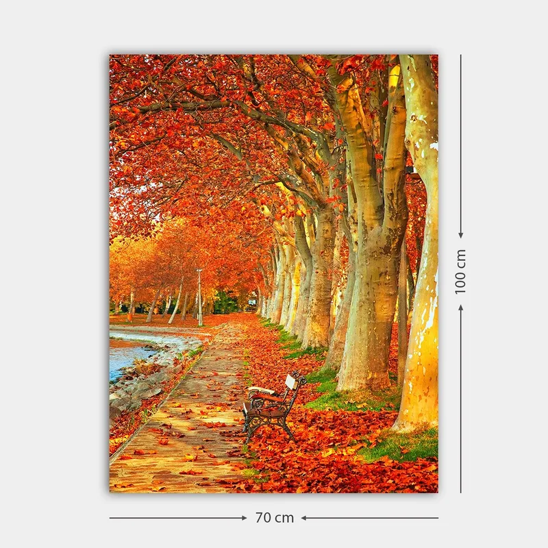 Canvastavla 70x100 cm - Vacker höstscen med en bänk längs en allé av träd med sprakande röda och orange löv - Röd / Orange / Gul - Inredning - Tavlor & posters - Canvastavla