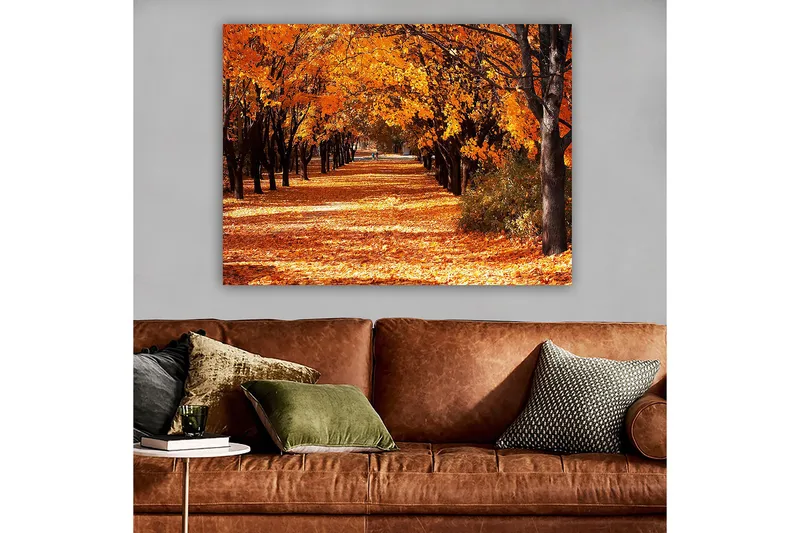 Canvastavla 70x100 cm - Vacker höstscen med träd i starka orangea och gula nyanser som skapar en inbjudande gångväg täckt av fallna löv - Orange / Gult / Brunt - Inredning - Tavlor & posters - Canvastavla