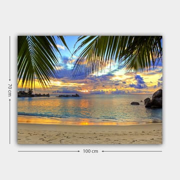 Canvastavla 70x100 cm - Vacker solnedgång över en strand med palmer som ramar in motivet - Blå / Orange / Grön - Inredning - Tavlor & posters - Canvastavla