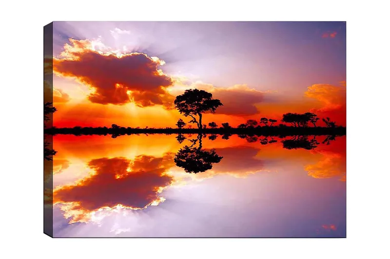 Canvastavla 70x100 cm - Vacker solnedgång med silhuetter av träd som speglas i en stilla vattenyta, Orange / Lila / Svart