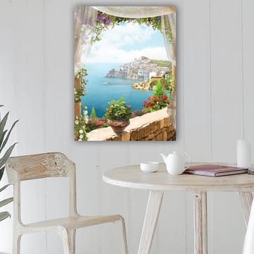 Canvastavla 70x100 cm - Vacker utsikt över en kuststad med färgglada hus och blomstrande växter, sedd genom en öppen fönsteröppning - Blå / Grön / Vit - Inredning - Tavlor & posters - Canvastavla