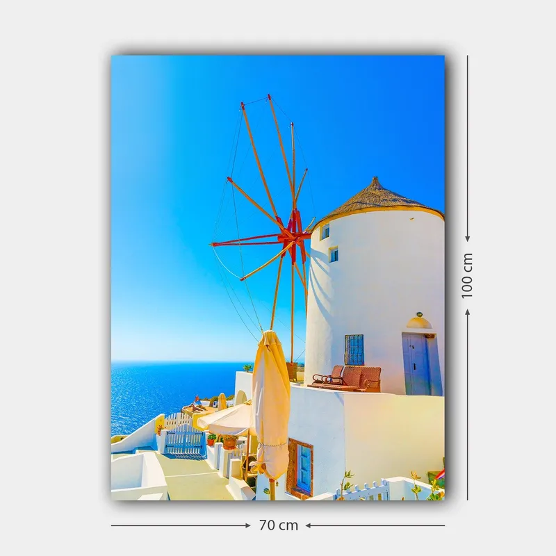 Canvastavla 70x100 cm - Vit vindm ölla med röd rotor på en klippa vid havet, omgiven av klarblå himmel och hav - Vit / Röd / Blå - Inredning - Tavlor & posters - Canvastavla