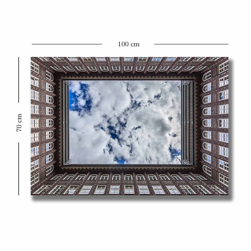 Canvastavla 70x100 cm - Vy av en byggnadsfasad som ramar in en spegelbild av himlen - Mörkbrun / Vit / Ljusblå - Inredning - Tavlor & posters - Canvastavla