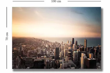Canvastavla 70x100 cm - Panoramavy av en stad med höga skyskrapor och en solnedgång som skapar en dramatisk atmosfär - Blå / Orange / Grå - Inredning - Tavlor & posters - Canvastavla