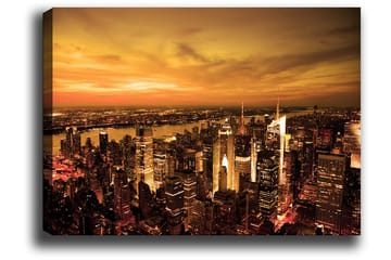 Canvastavla 70x100 cm - Panoramavy av en stad vid solnedgång med höga byggnader och en dramatisk himmel - Orange / Guld / Svart - Inredning - Tavlor & posters - Canvastavla