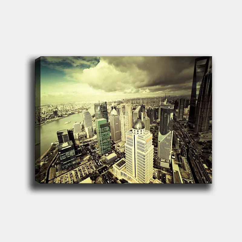 Canvastavla 70x100 cm - Panoramavy av en modern storstad med höga skyskrapor och en flod som flyter genom landskapet, Grön / Grå / Beige