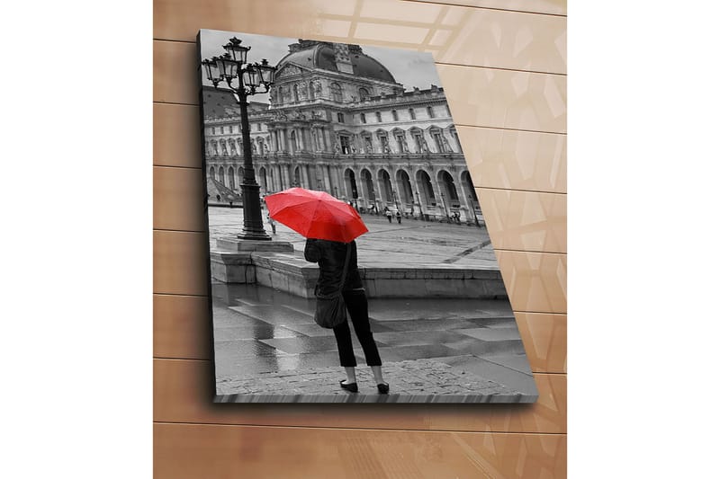 Canvastavla 70x100 cm - Person står med ett rött paraply i en regnig stadsmiljö framför en historisk byggnad - Röd / Svart - Inredning - Tavlor & posters - Canvastavla