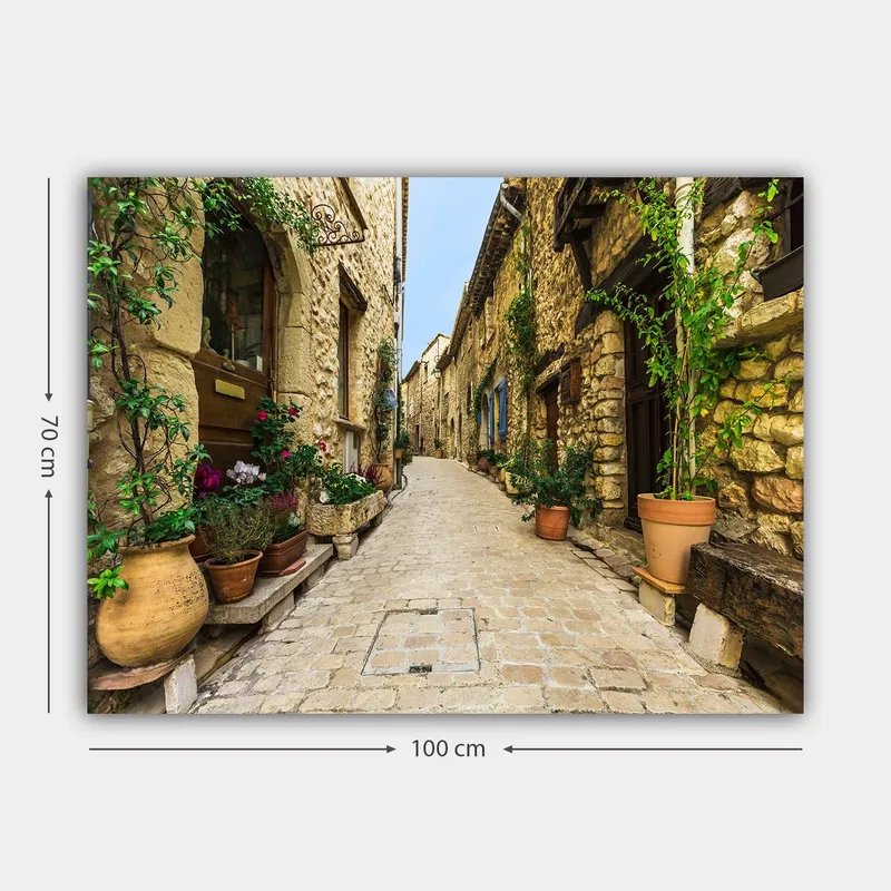 Canvastavla 70x100 cm - Pittoresk gränd i en gammal by med stenhus och blomkrukor - Beige / Grön / Terrakotta - Inredning - Tavlor & posters - Canvastavla
