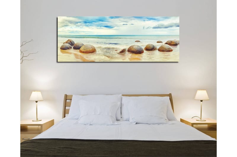 Canvastavla 80x30 cm - Runda stenar vid en strand med hav och himmel i bakgrunden - Blå / Beige / Grå - Inredning - Tavlor & posters - Canvastavla
