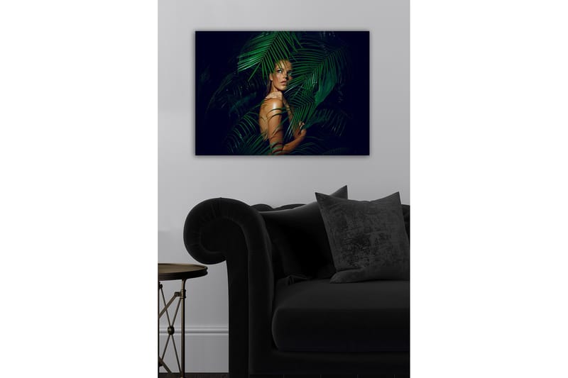 Canvastavla - Kvinna delvis dold bakom gröna palmblad - Mörkgrön / Hudton / Svart - Inredning - Tavlor & posters - Canvastavla