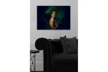 Canvastavla - Kvinna delvis dold bakom gröna palmblad - Mörkgrön / Hudton / Svart - Inredning - Tavlor & posters - Canvastavla