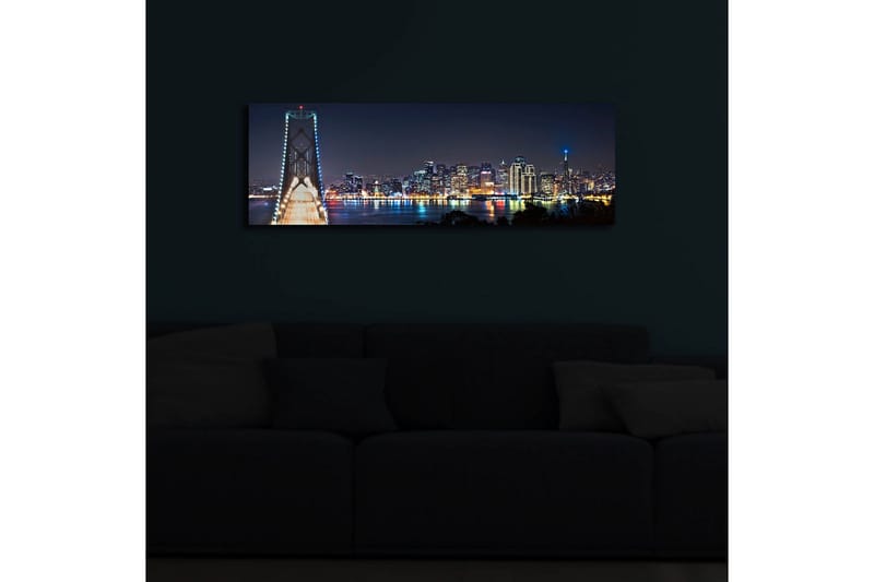 Canvastavla med LED-belysning 30x90 cm - Nattlig stadsbild med en bro och silhuetter av skyskrapor - Mörkblå / Ljusgrön / Vit - Inredning - Tavlor & posters - Canvastavla