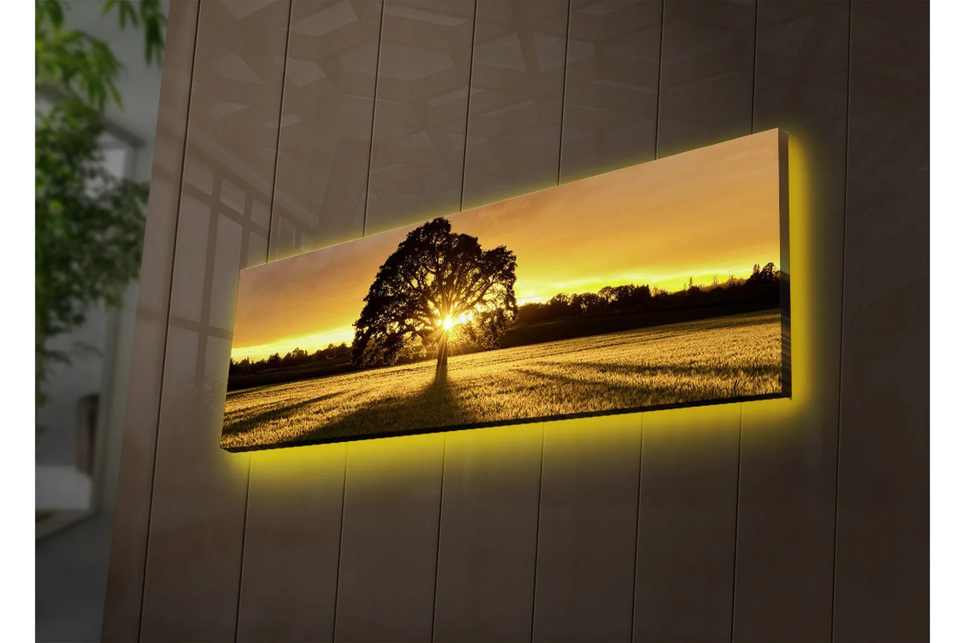 Canvastavla med LED-belysning 30x90 cm - Silhuett av ett träd mot en gyllene solnedgång - Guld / Svart / Grön