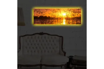Canvastavla med LED-belysning 30x90 cm - Solnedgång över en spegelblanka sjö med gräs i förgrunden - Orange / Guld / Svart - Inredning - Tavlor & posters - Canvastavla