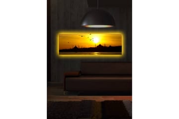 Canvastavla med LED-belysning 30x90 cm - Solnedgång över en stadssilhuett med fåglar i flykt - Guld / Svart / Orange - Inredning - Tavlor & posters - Canvastavla