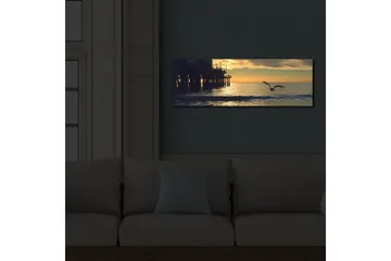 Canvastavla med LED-belysning 30x90 cm - Solnedgång över havet med en fågel i flykt - Orange / Blå / Grå - Inredning - Tavlor & posters - Canvastavla
