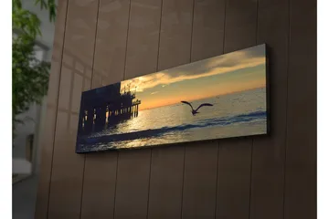 Canvastavla med LED-belysning 30x90 cm - Solnedgång över havet med en fågel i flykt - Orange / Blå / Grå - Inredning - Tavlor & posters - Canvastavla