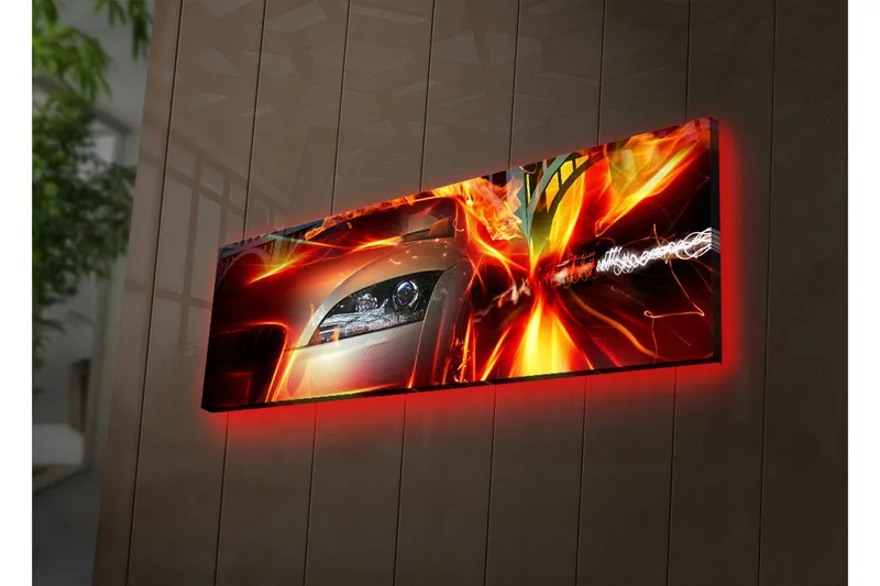 Canvastavla med LED-belysning 30x90 cm - Sportbil i rörelse med dynamiska ljuseffekter, Röd / Orange / Svart