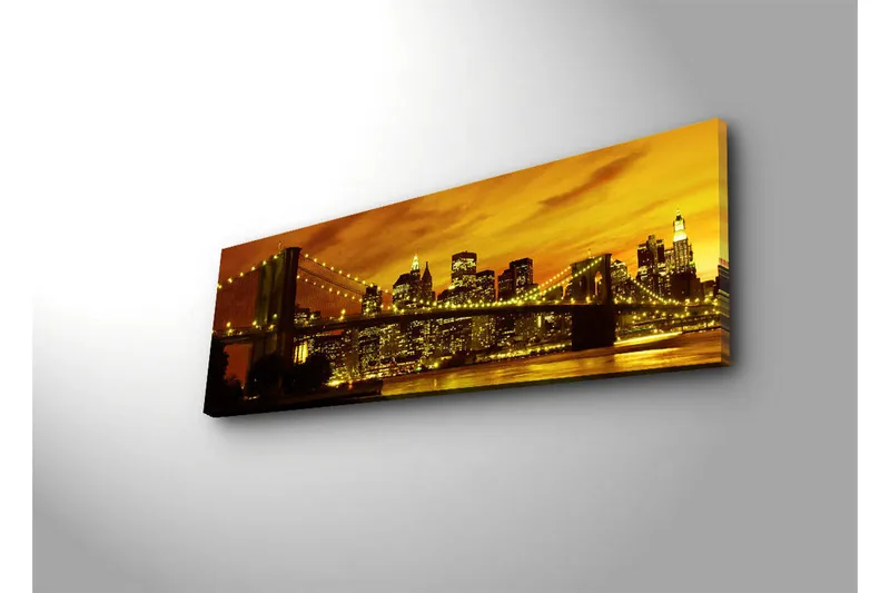 Canvastavla med LED-belysning 30x90 cm - Stadssilhuett med bro i solnedgångens gyllene ljus - Guld / Svart / Orange - Inredning - Tavlor & posters - Canvastavla