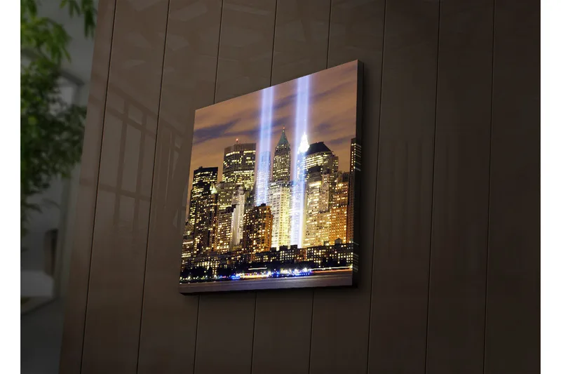 Canvastavla med LED-belysning 40x40 cm - Stadslandskap med ljusstrålar som symboliserar minnet av förlorade liv, Guld / Blå / Svart