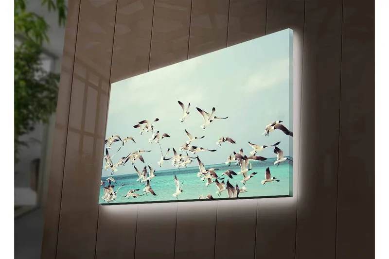 Canvastavla med LED-belysning - Flock av fåglar som flyger över en blå havsyta - Ljusblå / Vit / Svart - Inredning - Tavlor & posters - Canvastavla