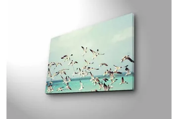 Canvastavla med LED-belysning - Flock av fåglar som flyger över en blå havsyta - Ljusblå / Vit / Svart - Inredning - Tavlor & posters - Canvastavla