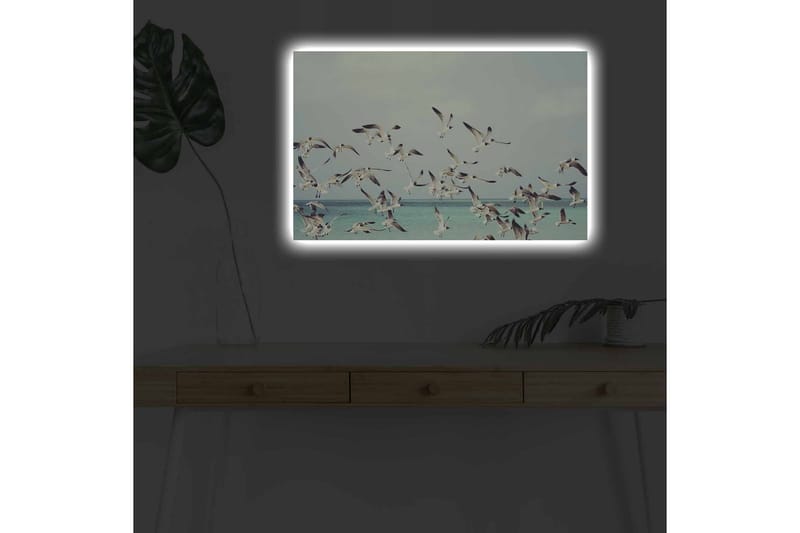 Canvastavla med LED-belysning - Flock av fåglar som flyger över en blå havsyta - Ljusblå / Vit / Svart - Inredning - Tavlor & posters - Canvastavla